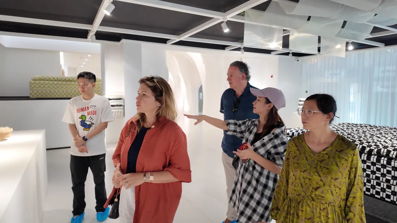 A group discussing furniture in a showroom