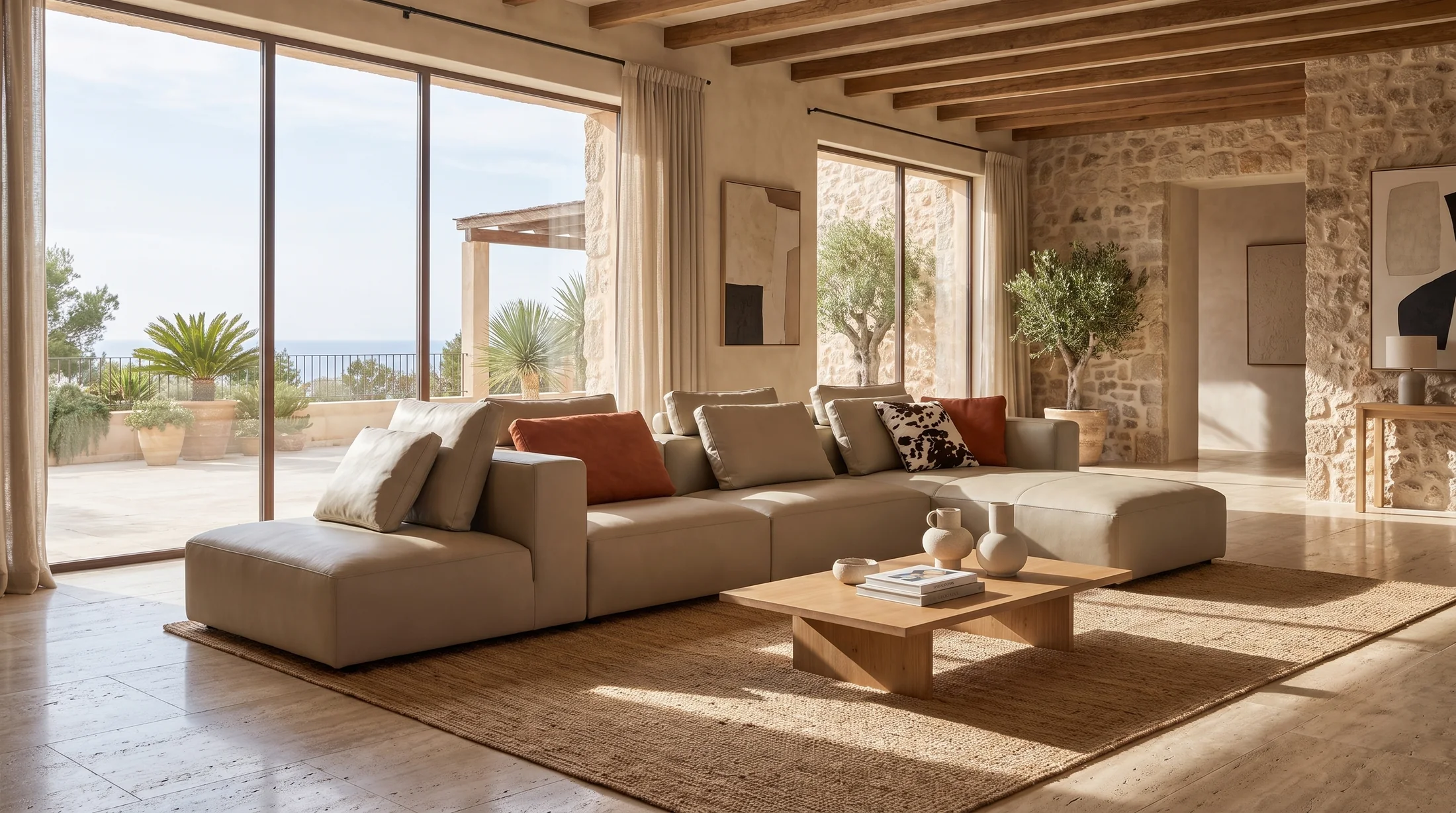 A warm living space with timber beams, natural textures and an open terrace